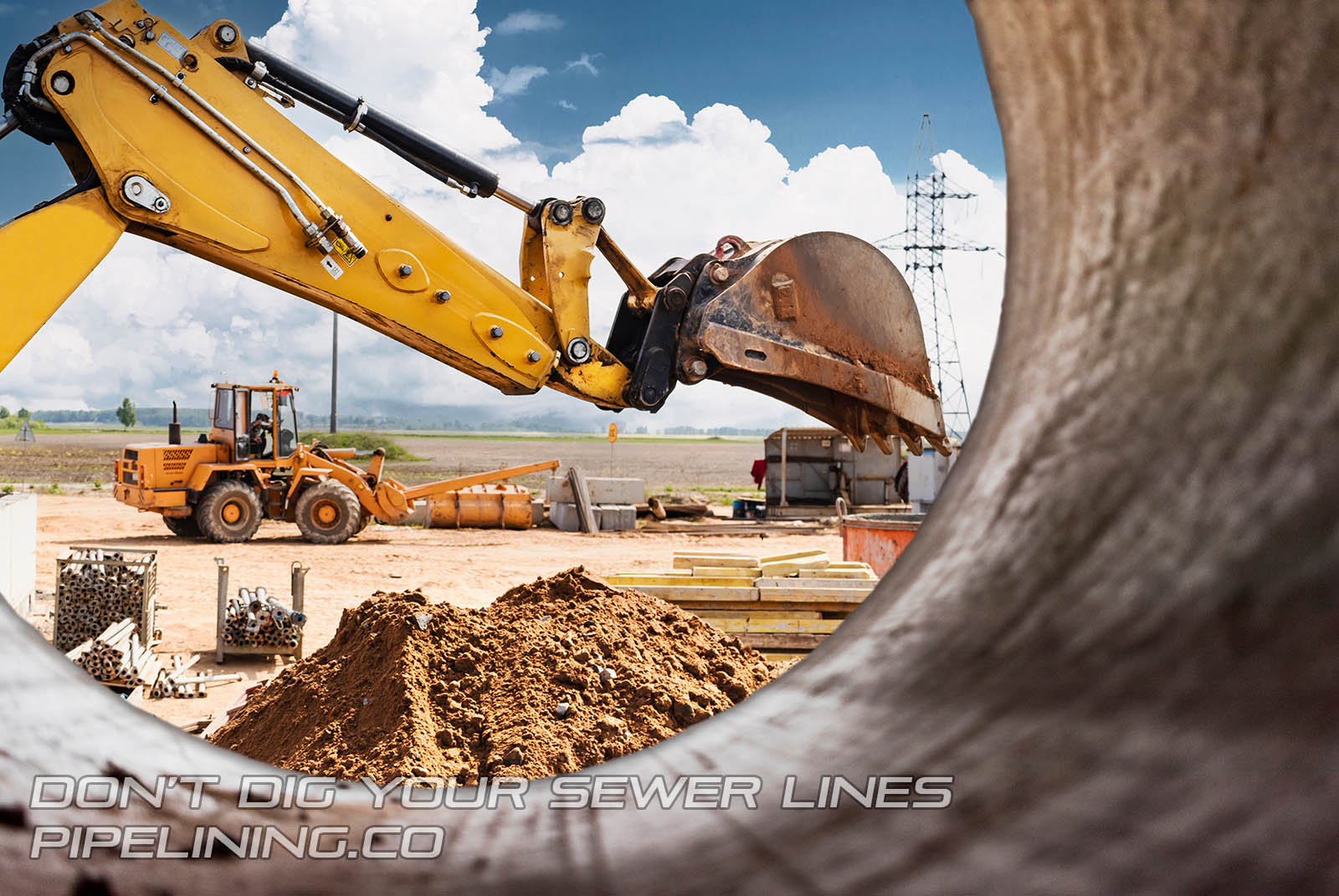 Excavator at construction site digging up sewer lines